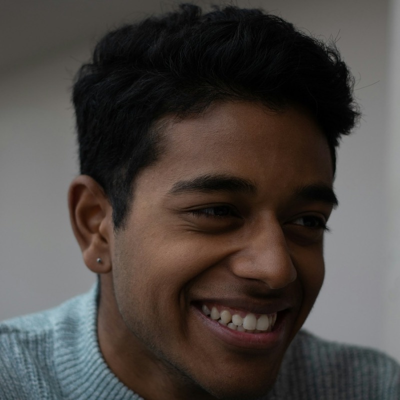 Arjun, smiling